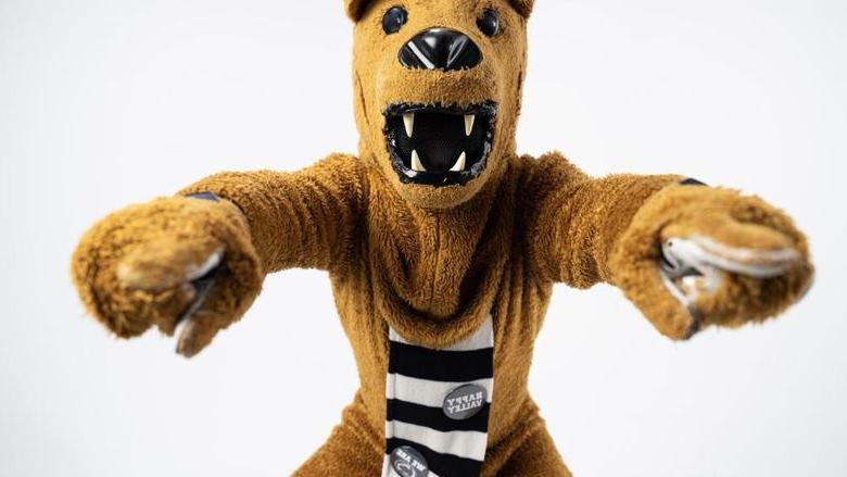 The Nittany Lion points to the camera with both hands